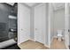 Modern bathroom includes stand alone toilet, stone shower, and sleek doors at 10038 W Meranto Ave, Las Vegas, NV 89178