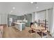 Modern kitchen with stainless steel appliances, white quartz countertops, and adjacent dining area at 10038 W Meranto Ave, Las Vegas, NV 89178