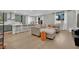 Open-concept living space with hardwood floors seamlessly connects the kitchen and living area at 10038 W Meranto Ave, Las Vegas, NV 89178