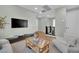 Loft space features neutral paint, mounted television, and view of stairway at 10038 W Meranto Ave, Las Vegas, NV 89178