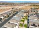 A wide shot showcases an overhead view of uniform Gathering homes, green spaces, and desert landscape in Nevada at 10042 Bismuth St, Las Vegas, NV 89183