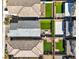 Aerial view of the backyards, showcasing manicured lawns and brick pavers at 10042 Bismuth St, Las Vegas, NV 89183