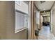 Hallway with tile flooring, modern decor, and open access to the living area at 10042 Bismuth St, Las Vegas, NV 89183