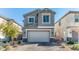Charming two-story home with a brick driveway and a well-maintained front yard at 10042 Bismuth St, Las Vegas, NV 89183