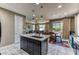 The open-concept kitchen seamlessly connects to the living and dining areas at 10042 Bismuth St, Las Vegas, NV 89183