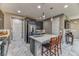 Modern kitchen featuring stainless steel appliances, a kitchen island, and granite countertops at 10042 Bismuth St, Las Vegas, NV 89183