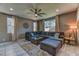 Comfortable living area featuring a large sectional sofa, accent lighting, and stylish decor at 10042 Bismuth St, Las Vegas, NV 89183