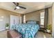 Comfortable main bedroom featuring plush carpet, ample windows, and stylish neutral decor at 10042 Bismuth St, Las Vegas, NV 89183