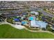 Aerial view of the neighborhood recreational amenities, including a pool, playground, and sports fields at 10250 Tree Blossom Ave, Las Vegas, NV 89166