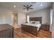 Bright bedroom with hardwood flooring, ceiling fan, and ensuite bathroom at 10250 Tree Blossom Ave, Las Vegas, NV 89166
