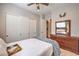 Bedroom featuring closet doors, dresser, and a tray atop a well-made bed for cozy living at 10250 Tree Blossom Ave, Las Vegas, NV 89166