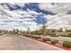 Gated community entrance sign, 'Skye Mesa,' surrounded by lush landscaping and well-manicured grounds at 10250 Tree Blossom Ave, Las Vegas, NV 89166