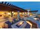 Inviting outdoor seating area with fire pit and stylish furniture at 10250 Tree Blossom Ave, Las Vegas, NV 89166