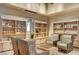 Welcoming sitting area with built-in display shelves and inviting chairs, perfect for relaxing at 10250 Tree Blossom Ave, Las Vegas, NV 89166