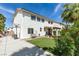 Spacious backyard with a basketball hoop, artificial grass, patio, and flowering bushes at 1223 Starstone Ct, Henderson, NV 89014