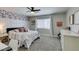 Charming bedroom with floral wallpaper and a full bed, desk, and dresser in soft, neutral tones at 1223 Starstone Ct, Henderson, NV 89014