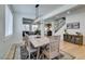 Bright dining room features modern light fixture, hardwood floors, and stylish area rug at 1223 Starstone Ct, Henderson, NV 89014