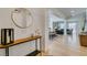 Inviting entryway features modern console table, round mirror and open floor plan at 1223 Starstone Ct, Henderson, NV 89014