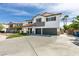 Two story home with a three car garage and a well manicured lawn at 1223 Starstone Ct, Henderson, NV 89014