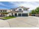 Two story home with a three car garage and a well manicured lawn at 1223 Starstone Ct, Henderson, NV 89014
