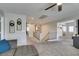 Bright upstairs hallway with gray carpet, white trim and doorways leading to bedrooms and bathrooms at 1223 Starstone Ct, Henderson, NV 89014