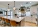 Contemporary kitchen featuring a spacious island with bar seating and stainless steel appliances, perfect for entertaining at 1223 Starstone Ct, Henderson, NV 89014