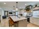 Bright kitchen with an island, stainless steel appliances, and a view into the living area, great for modern living at 1223 Starstone Ct, Henderson, NV 89014