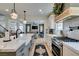 Modern kitchen with a large island, stainless appliances, and a view into the living area, perfect for entertaining at 1223 Starstone Ct, Henderson, NV 89014