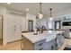 Stylish kitchen with ample counter space, an island, and stainless steel appliances, designed for both cooking and gathering at 1223 Starstone Ct, Henderson, NV 89014