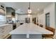 Elegant kitchen with white cabinetry, stainless steel appliances, and a functional layout, perfect for Gathering meals at 1223 Starstone Ct, Henderson, NV 89014