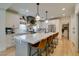 Well-lit kitchen featuring a large island, stainless steel appliances, and ample counter space for cooking and gathering at 1223 Starstone Ct, Henderson, NV 89014