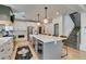 Spacious kitchen with a large center island, modern appliances, and stylish pendant lighting, ideal for culinary enthusiasts at 1223 Starstone Ct, Henderson, NV 89014