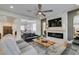 Open-concept living room showing fireplace and connected dining and kitchen spaces at 1223 Starstone Ct, Henderson, NV 89014