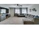 Large living room featuring a comfortable gray sectional sofa and wall-mounted television with soundbar at 1223 Starstone Ct, Henderson, NV 89014