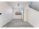 Well-lit basement with a window, a utility closet, and light gray floors at 1618 Meno Peak St, Las Vegas, NV 89115