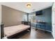 Cozy bedroom with a bed, desk, and mounted TV; a comfortable and functional living space at 1618 Meno Peak St, Las Vegas, NV 89115