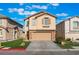 Charming two-story home with a well-manicured lawn and a two-car garage at 1618 Meno Peak St, Las Vegas, NV 89115