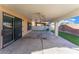 Large, covered patio features artificial turf, speakers, and ample space at 1618 Meno Peak St, Las Vegas, NV 89115
