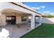 Relax on this covered patio with outdoor speakers and artificial turf at 1618 Meno Peak St, Las Vegas, NV 89115
