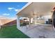 Enjoy outdoor living on this covered patio with a ceiling fan and low-maintenance artificial grass at 1618 Meno Peak St, Las Vegas, NV 89115