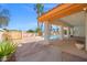 A large backyard patio area and pool with palm trees, perfect for entertaining at 1840 Myrtle Island Dr, Las Vegas, NV 89117