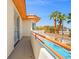 Balcony with outdoor pool access and views of the neighborhood on a sunny day at 1840 Myrtle Island Dr, Las Vegas, NV 89117