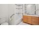 Bathroom with combined shower and bathtub with tiled walls and a wood vanity at 1840 Myrtle Island Dr, Las Vegas, NV 89117