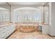 Luxurious bathroom with a soaking tub, vanity, and lots of natural light at 1840 Myrtle Island Dr, Las Vegas, NV 89117