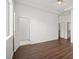 Spacious bedroom with wood floors, tray ceiling, and direct access to the bathroom at 1840 Myrtle Island Dr, Las Vegas, NV 89117