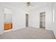 Bedroom featuring natural light, an adjacent bathroom, and a large walk-in closet at 1840 Myrtle Island Dr, Las Vegas, NV 89117