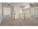 Hallway with wood railing, carpet, and decorative ceiling design at 1840 Myrtle Island Dr, Las Vegas, NV 89117