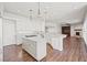 Bright open kitchen with marble counters, stainless appliances, breakfast bar, and modern design at 1840 Myrtle Island Dr, Las Vegas, NV 89117