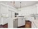 Spacious white kitchen features stainless appliances, marble countertops, and a center island at 1840 Myrtle Island Dr, Las Vegas, NV 89117