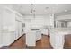 Spacious white kitchen with stainless appliances, marble countertops, and center island at 1840 Myrtle Island Dr, Las Vegas, NV 89117